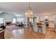 Open living space showcasing a living room with fireplace connecting to the kitchen with a breakfast bar at 1564 Beaver Creek Lane, Snellville, GA 30078