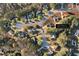 Aerial view of homes nestled within a lush, green landscape at 4625 Thermal Ct, Douglasville, GA at 4625 Thermal Ct, Douglasville, GA 30135