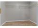 Walk-in closet with wire shelving and hardwood floors at 4625 Thermal Ct, Douglasville, GA 30135