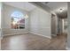 Dining room with large window and modern chandelier at 4625 Thermal Ct, Douglasville, GA 30135