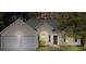 Charming single-story home featuring a two-car garage and arched window for enhanced curb appeal at 4625 Thermal Ct, Douglasville, GA 30135