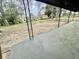 Covered back porch overlooking a spacious backyard with mature trees at 6123 Deerfield Ct, Morrow, GA 30260