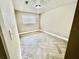 Cozy bedroom with window, stylish herringbone flooring, and light neutral walls at 6123 Deerfield Ct, Morrow, GA 30260
