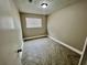 Bedroom showcases herringbone flooring, a window, and calming neutral wall color at 6123 Deerfield Ct, Morrow, GA 30260