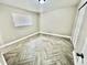 Cozy bedroom featuring natural light, herringbone tiled flooring and a spacious closet at 6123 Deerfield Ct, Morrow, GA 30260
