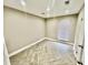 Cozy bedroom with natural light, herringbone tiled flooring and neutral paint throughout at 6123 Deerfield Ct, Morrow, GA 30260