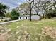 Quaint home with verdant lawn surrounded by mature trees on an overcast day at 6123 Deerfield Ct, Morrow, GA 30260