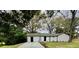 Charming one story home featuring a freshly painted exterior, well-manicured lawn, and newly paved driveway at 6123 Deerfield Ct, Morrow, GA 30260