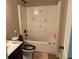 Bathroom with a white shower and tub combination and tile flooring at 6802 Potomac, Fairburn, GA 30213