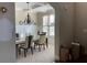 Dining room with coffered ceiling, chandelier, and plenty of natural light at 6802 Potomac, Fairburn, GA 30213