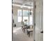Bright dining room boasts coffered ceilings and a charming chandelier over the table at 6802 Potomac, Fairburn, GA 30213