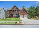 Lovely two story brick home with attached garage and front yard at 6802 Potomac, Fairburn, GA 30213
