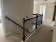 Hallway with wood railings and carpet at 6802 Potomac, Fairburn, GA 30213
