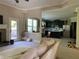 A bright living room leads into the kitchen with light beige walls and natural light at 6802 Potomac, Fairburn, GA 30213