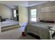Spacious main bedroom with a seating area, carpet, and plenty of light at 6802 Potomac, Fairburn, GA 30213