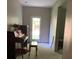 Music room features a piano, natural light from a glass door, and serene ambiance at 6802 Potomac, Fairburn, GA 30213