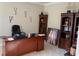 Office space with built-in bookshelves, a large desk, and comfortable seating at 6802 Potomac, Fairburn, GA 30213