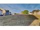 Large backyard offering plenty of space for outdoor activities with a view of neighboring houses at 6808 Foxfire Pl, South Fulton, GA 30349