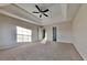 Bedroom featuring carpet flooring, recessed lighting, tray ceilings with fan and window light at 6808 Foxfire Pl, South Fulton, GA 30349