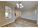 Open dining area with wood floors and a view to the backyard at 6808 Foxfire Pl, South Fulton, GA 30349