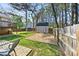 Charming backyard with a shed, patio area, and a deck, ideal for relaxing and entertaining in a private outdoor space at 2876 Davis Mill N Rd, Dallas, GA 30157