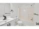 Clean bathroom with white fixtures, including a shower-tub combination and sleek black hardware accents at 2876 Davis Mill N Rd, Dallas, GA 30157
