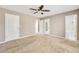 Large bedroom features a ceiling fan, carpet flooring, and ensuite bathroom, creating a relaxing retreat at 2876 Davis Mill N Rd, Dallas, GA 30157