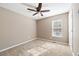 Bedroom with neutral walls, ceiling fan, window with blinds that let in natural light, and carpeted floors at 2876 Davis Mill N Rd, Dallas, GA 30157