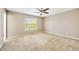 Spacious bedroom with neutral walls, carpet, and large window with blinds offering plenty of natural light at 2876 Davis Mill N Rd, Dallas, GA 30157