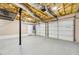 Spacious three-car garage with white doors and high ceilings, offering plenty of storage and parking space at 2876 Davis Mill N Rd, Dallas, GA 30157