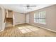 Bright living room features stylish wood-look flooring, ample natural light, and access to upper level at 2876 Davis Mill N Rd, Dallas, GA 30157