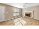Inviting living room features stylish wood-look flooring and a stone fireplace at 2876 Davis Mill N Rd, Dallas, GA 30157