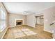 Spacious living room features stylish wood-look flooring and a cozy fireplace at 2876 Davis Mill N Rd, Dallas, GA 30157