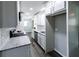 Modern kitchen with white cabinets, granite countertops, and stainless steel appliances at 3888 W Oak Dr, Douglasville, GA 30135