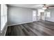 An open-concept living room with hardwood floors, fresh paint, and lots of natural light at 3888 W Oak Dr, Douglasville, GA 30135