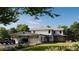 Beautiful modern farmhouse featuring a three-car garage and well-manicured lawn at 4385 Hickory Flat Hwy, Canton, GA 30115