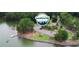 Picturesque view of a serene lake with boat docks, boat ramps, picnic shelters and a parking area at 4385 Hickory Flat Hwy, Canton, GA 30115