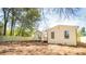 Spacious backyard showcasing a new fence and lush trees surrounding a well-maintained white home at 716 Sunfield Nw Dr, Lilburn, GA 30047