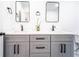Bathroom featuring double vanity with marble countertops, undermount sinks, and modern black fixtures at 716 Sunfield Nw Dr, Lilburn, GA 30047