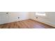 Bright bedroom with hardwood floors and a large window at 716 Sunfield Nw Dr, Lilburn, GA 30047