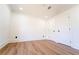 Large bedroom with hardwood floors, closet doors, and white trim at 716 Sunfield Nw Dr, Lilburn, GA 30047