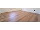 Spacious bedroom with wood floors and white trim at 716 Sunfield Nw Dr, Lilburn, GA 30047
