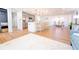 Open concept kitchen with large island, stainless steel appliances and view into the dining room at 716 Sunfield Nw Dr, Lilburn, GA 30047