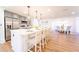Bright, open kitchen featuring a large island with seating and modern appliances at 716 Sunfield Nw Dr, Lilburn, GA 30047