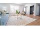 Cozy living room featuring natural light and modern design elements, with comfortable seating and stylish decor at 716 Sunfield Nw Dr, Lilburn, GA 30047