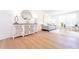 Elegant living room with stylish cabinet, modern decor, and hardwood floors at 716 Sunfield Nw Dr, Lilburn, GA 30047
