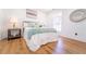Comfortable main bedroom with decor, natural light, and hardwood flooring at 716 Sunfield Nw Dr, Lilburn, GA 30047