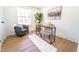Cozy home office with a modern desk, soft rug, and a comfortable chair at 716 Sunfield Nw Dr, Lilburn, GA 30047