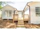 Rear exterior with a newly constructed deck and bright blue door at 716 Sunfield Nw Dr, Lilburn, GA 30047