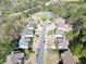 Aerial shot of a residential street featuring lovely homes and a community area with tennis courts and a pool at 140 Kirkland Dr, Lawrenceville, GA 30044